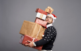 man carrying christmas boxes