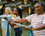 older individuals using a stretch band