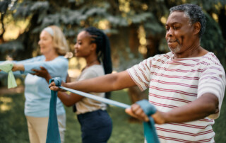 older individuals using a stretch band